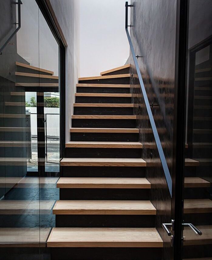 Glass divider window beside stairs
