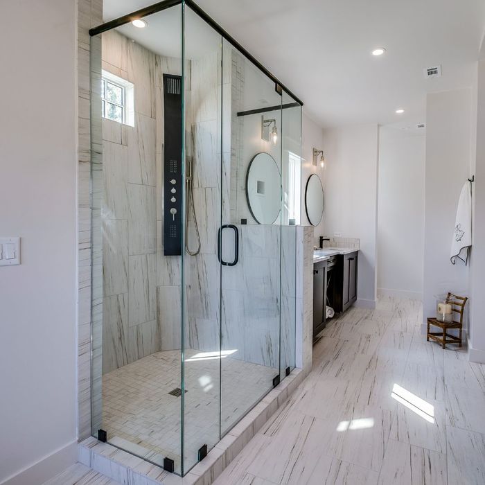 Side view of semi frameless glass shower enclosure
