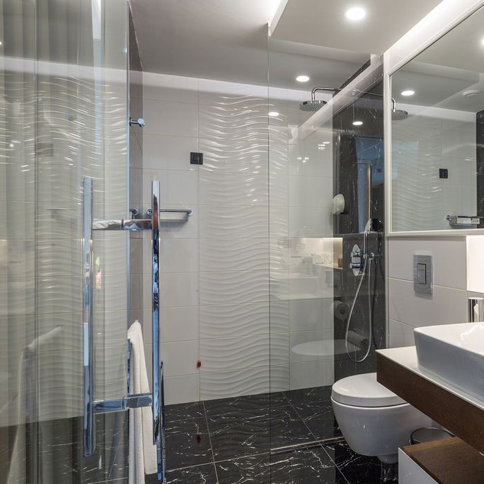 Sleek frameless shower enclosure